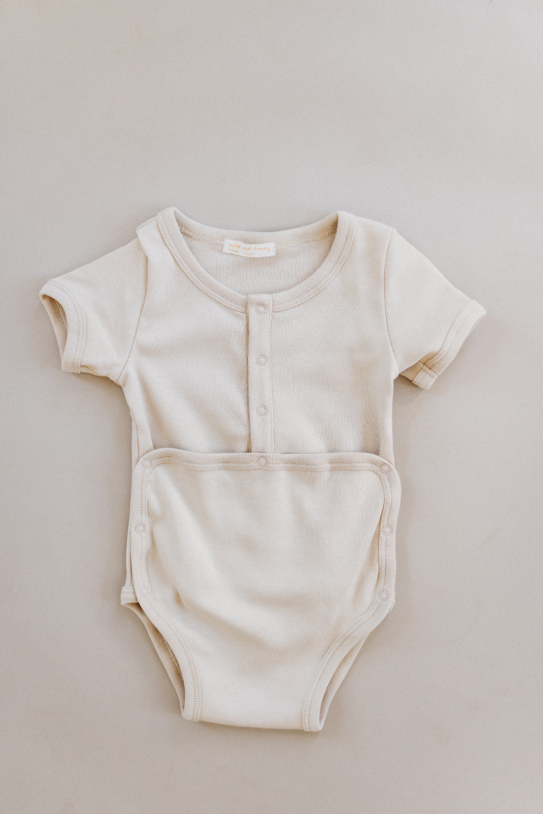 Load image into Gallery viewer, short sleeve snap onesie, angora
